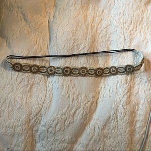 Worn twice. Sequence headband